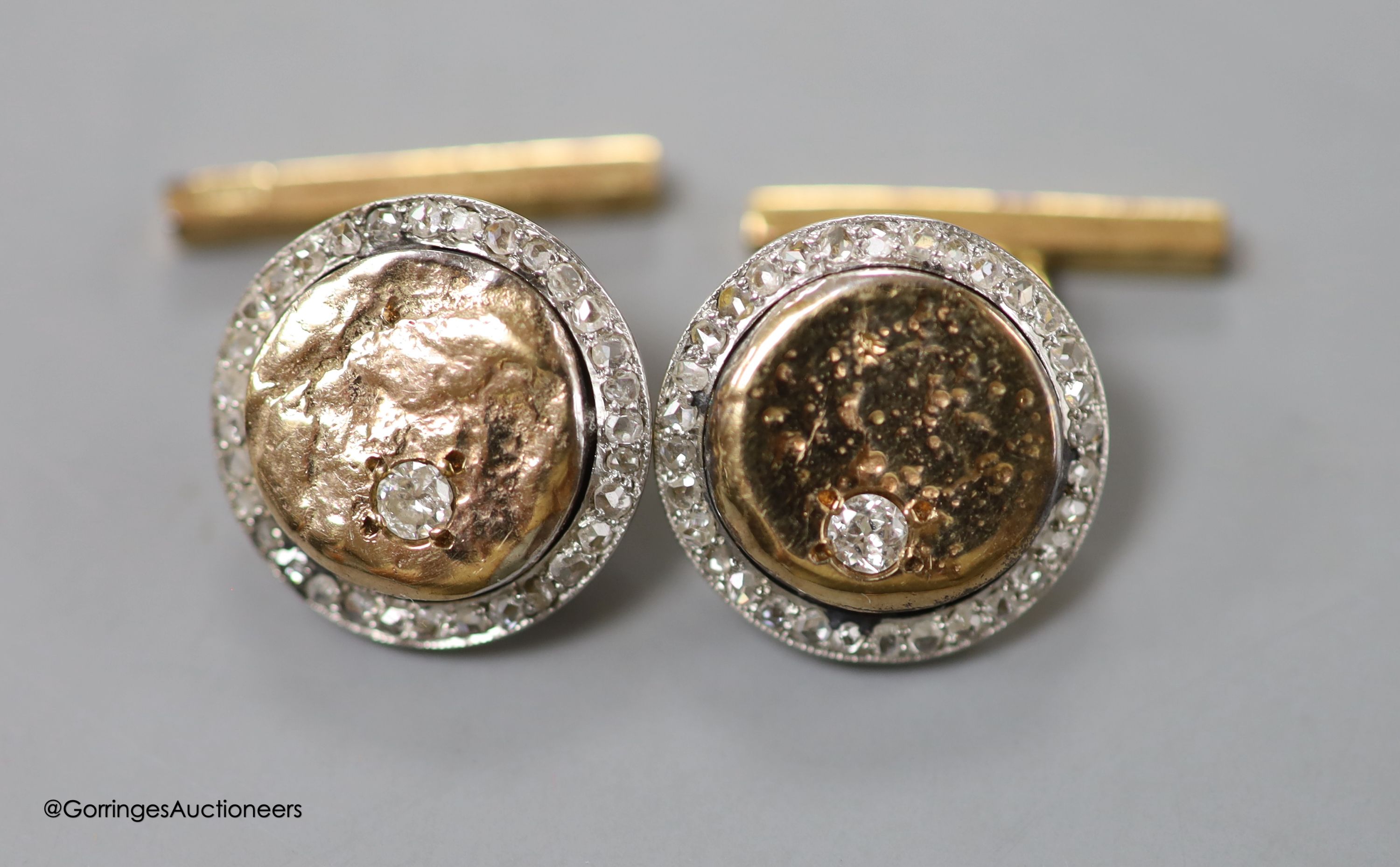 A pair of 9ct and diamond set circular cufflinks, 15mm, gross 12.4 grams and a pair of gold plated? and lapis lazuli set cufflinks by Alfred Dunhill.